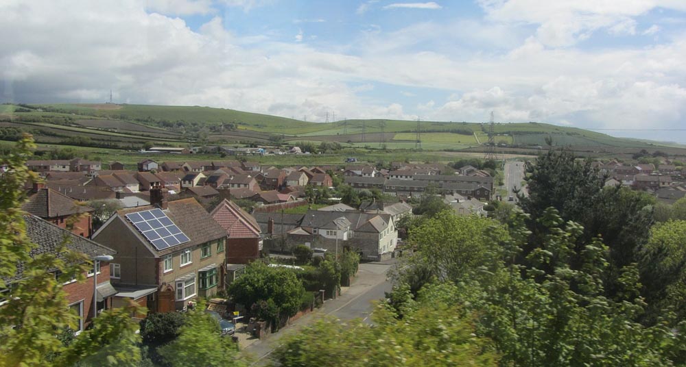 Photo of residential area and plains in the background